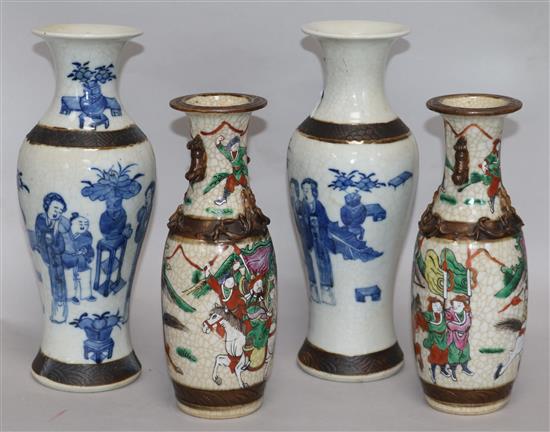 An early 20th century pair of crackle glazed vases and a pair of blue and white vases H.29cms Tallest